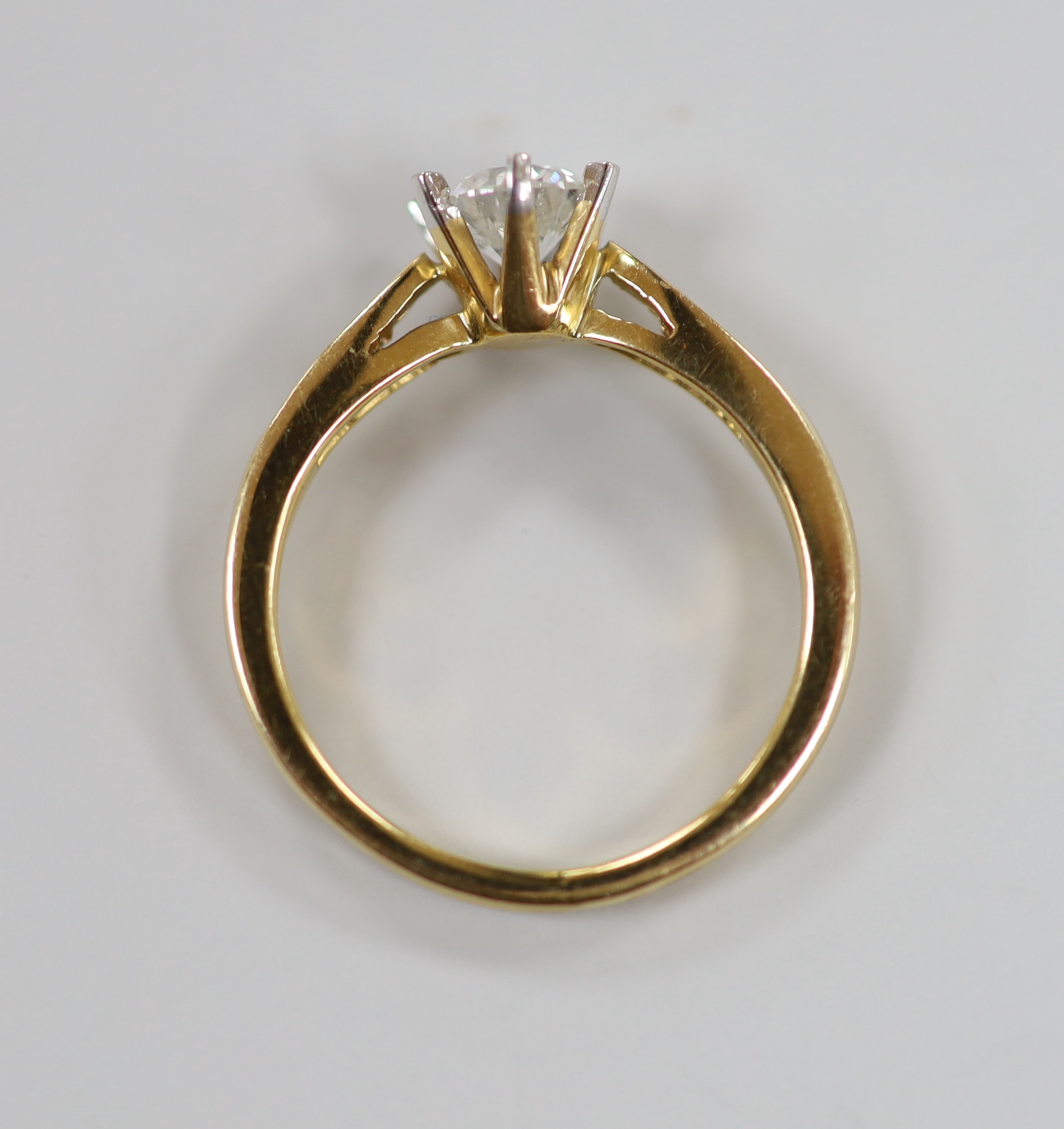 A yellow metal and solitaire diamond ring, size O, gross weight 4.2 grams